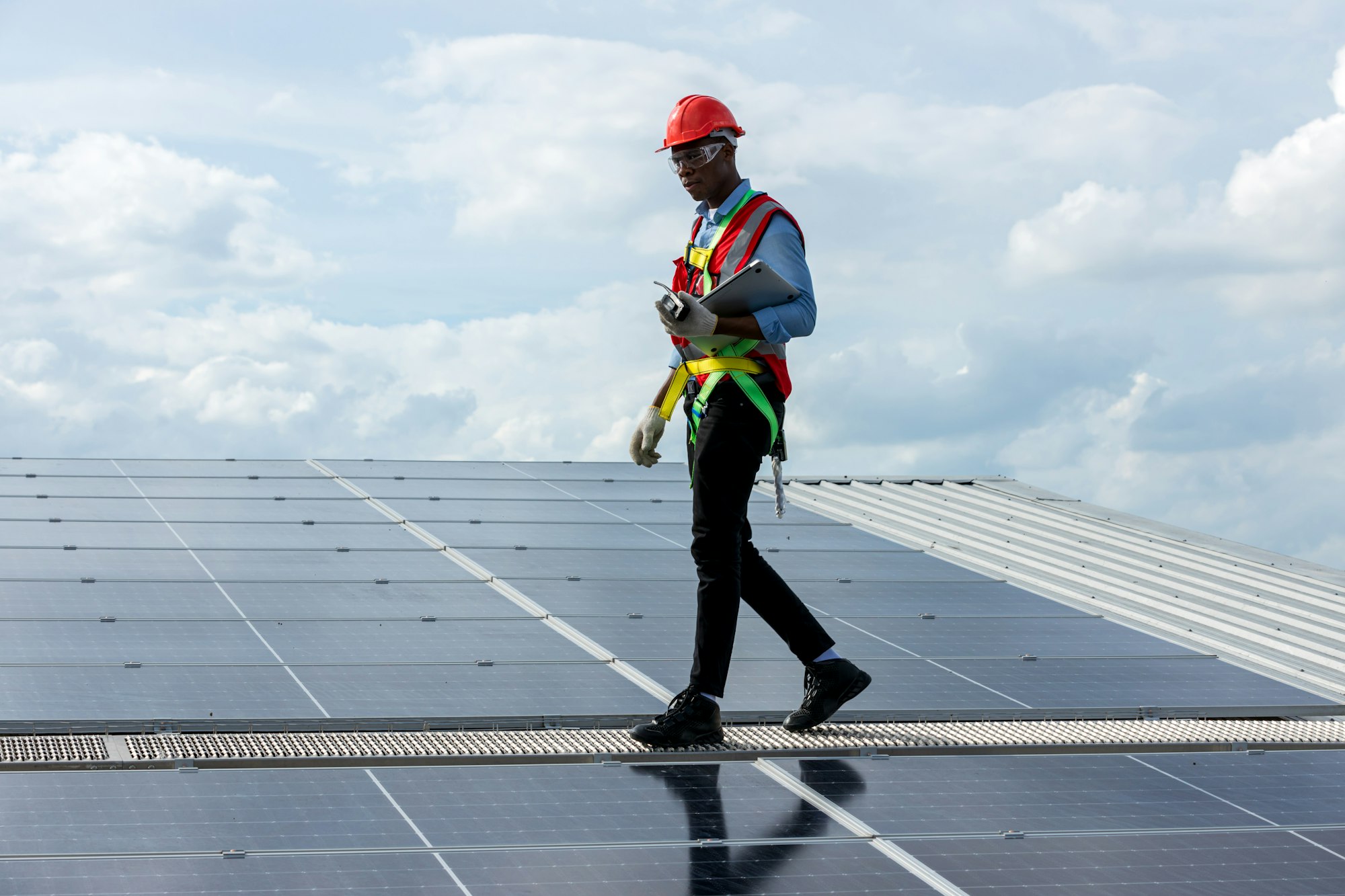 Engineer working setup Solar panel at the roof top. Engineer or worker work on solar panels or solar